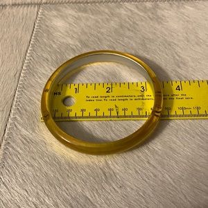Yellow plastic/resin bracelet